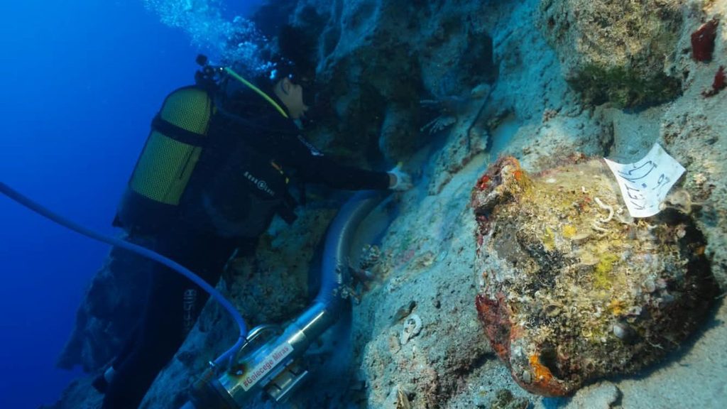 Underwater archaeologist examining a shipwreck off the coast of Turkey.