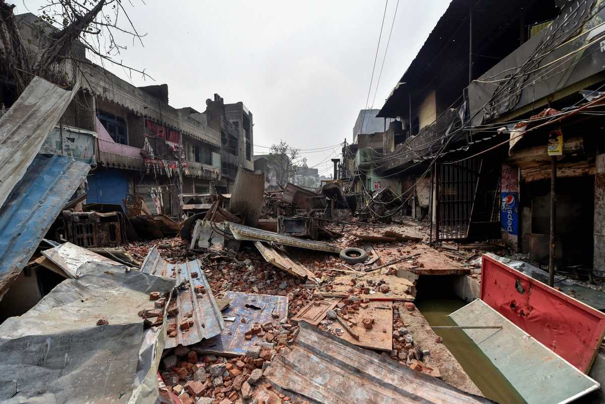 Brick-bats are seen amid vandalized properties in the Bhagirathi Vihar area of the riot-affected northeast Delhi.