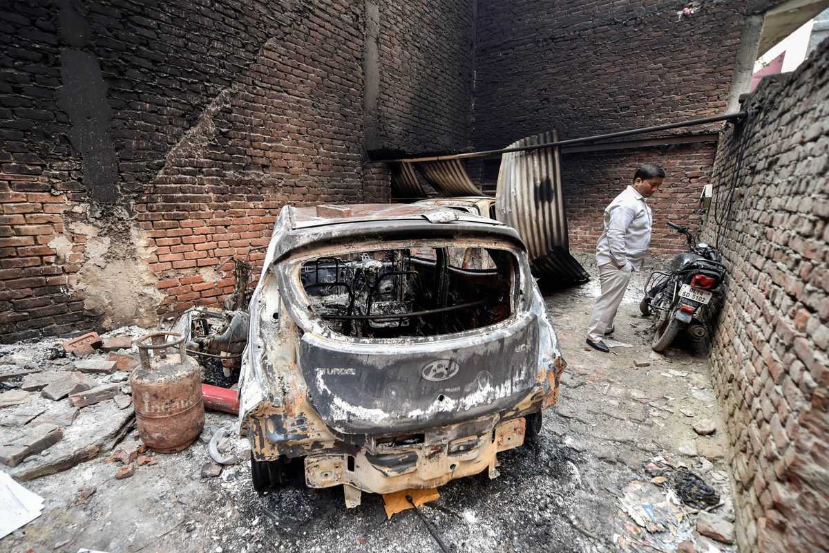  Charred remains of vehicles set ablaze by rioters during communal violence over the amended citizenship law at the Shivpuri area of the riot-affected northeast Delhi