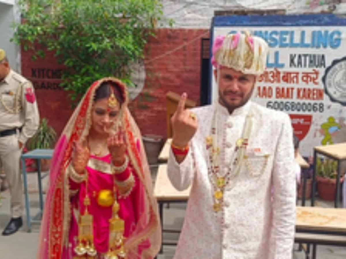 J&K: Couple cast vote on their marriage day in Kathua