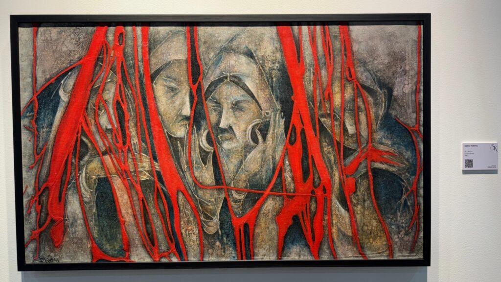 Abstract painting of three faces with red streaks and textured background.