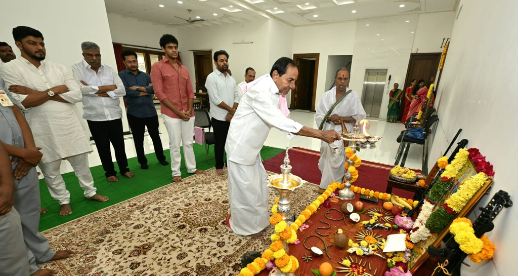 Revanth Reddy performing a traditional ritual during Dasara celebrations.
